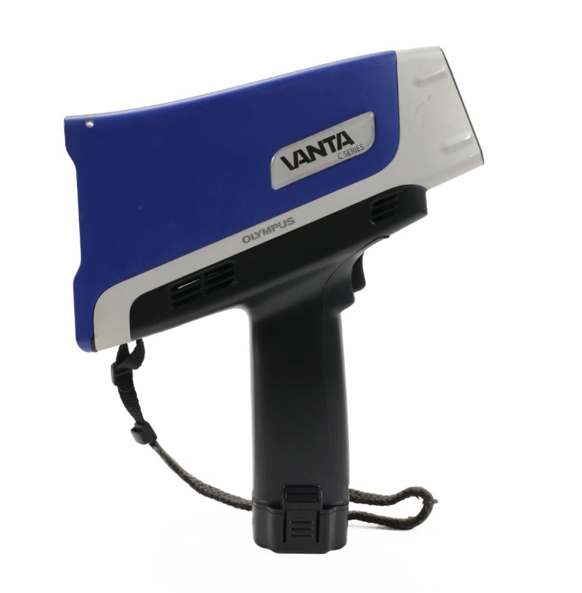 Olympus Vanta VCR handheld XRF analyzer performing portable alloy and elemental analysis in an industrial environment